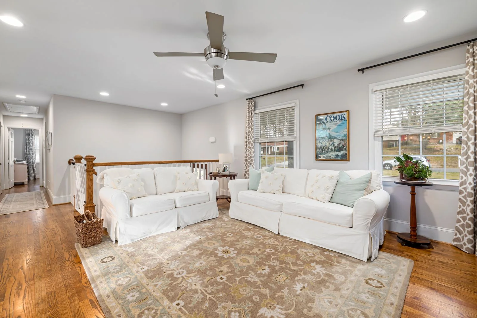Rug and wooden flooring in a living room, illustrating mixed-floor cleaning with INTETURE Cordless Vacuum